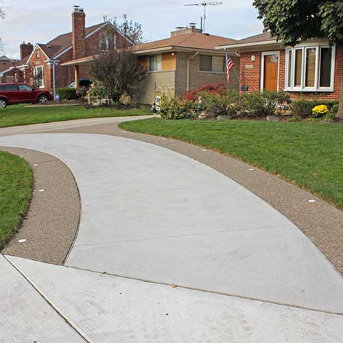 Stamped concrete patio with border accents and inset lights